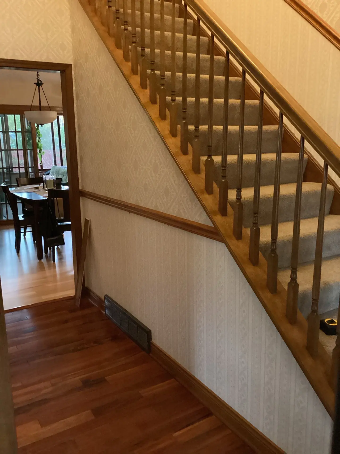 Original staircase with wallpaper and carpet